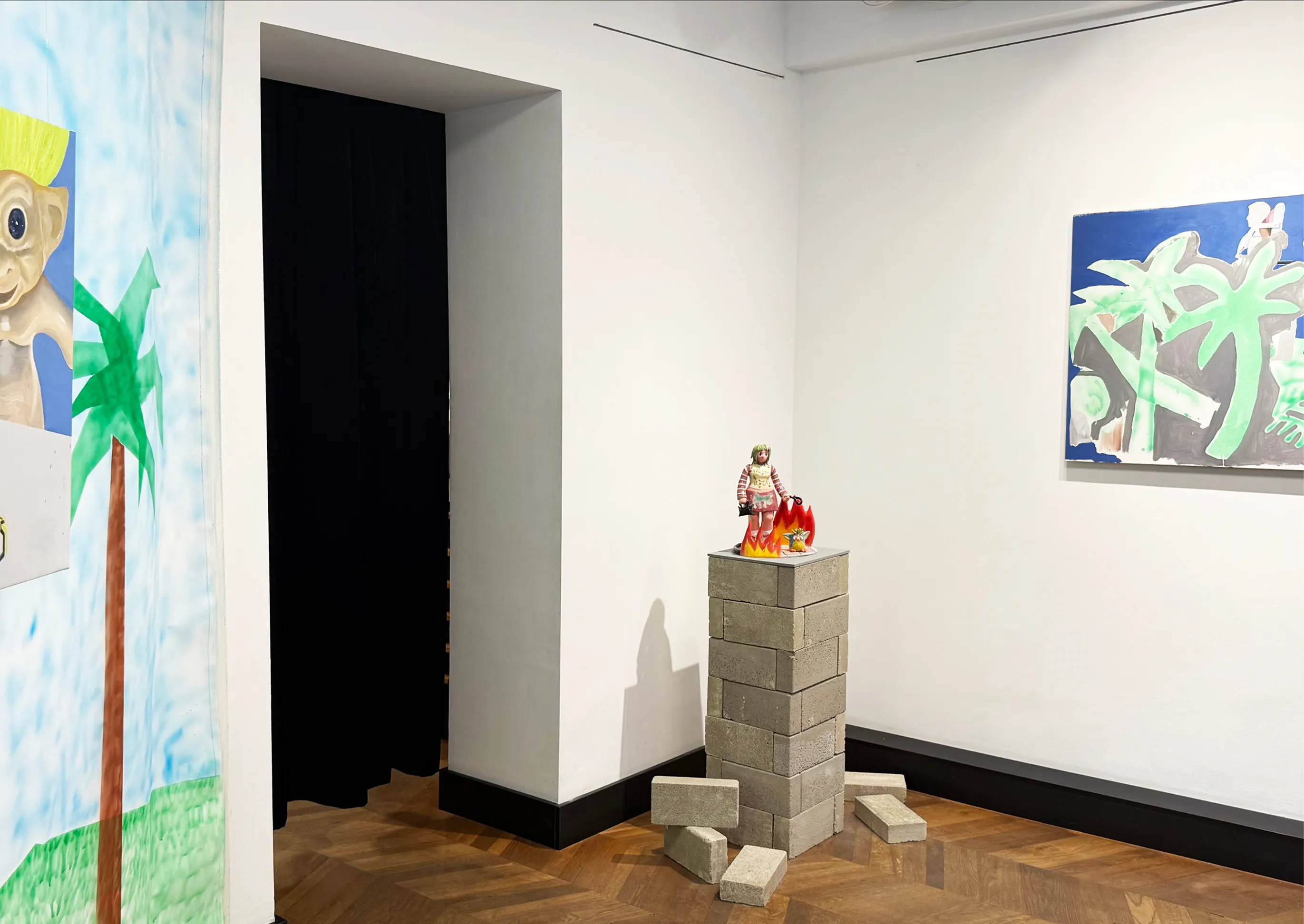 Doomscrolling installation view showing the painted backdrop from a different angle